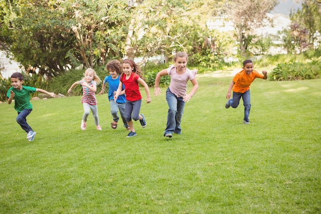 Children running on the grass