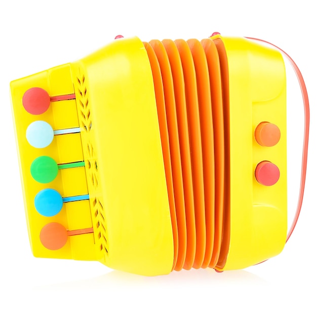 Children's musical instrument accordion Yellow accordion made of plastic on a white background