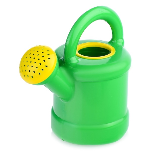 Children's plastic watering can for playing in the sandbox or in the garden Color watering can for watering flowers highlighted on a white background closeup