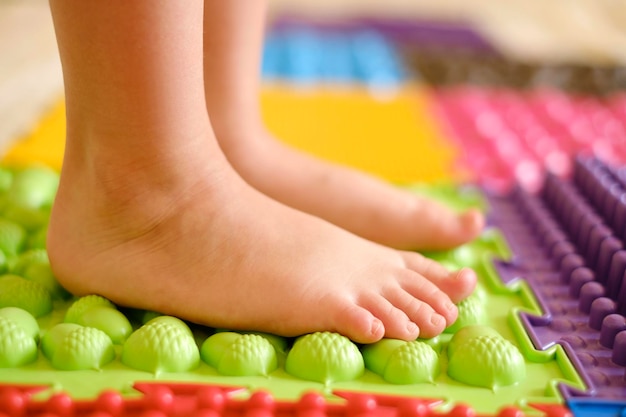 Children's preventive orthopedic massage mat made of puzzles with surfaces of various shapes