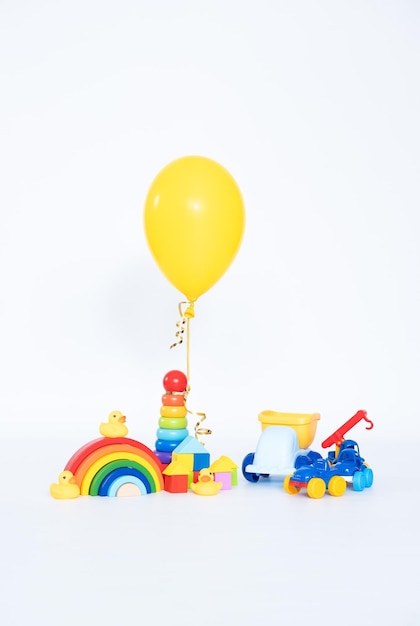 Children's toy wooden and colourfull and three balloons toy shop isolated on white background Educational toys