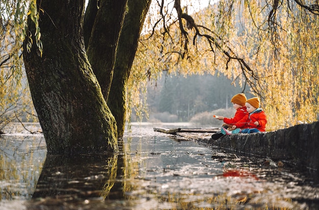 Children spend time outside in fresh and cold air Small kids play in nature