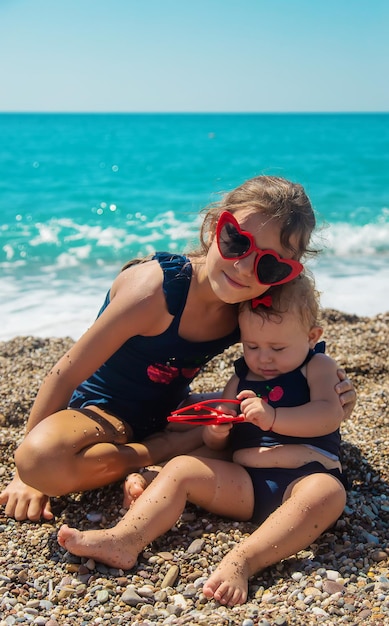 Children in sunglasses on the beach. Selective focus. Kids.