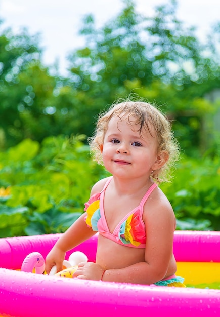 Children swim in the pool Selective focus