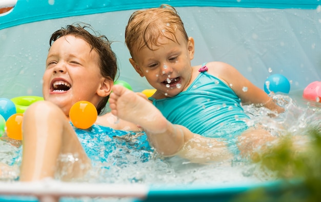 Children swimming in kid pool