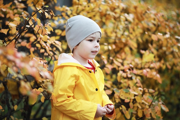 Children walk in the autumn park