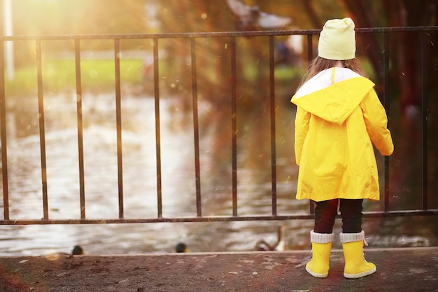 Children walk in the autumn park