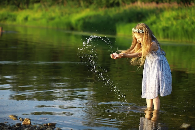 Children walk in the summer in nature Child on a sunny spring morning in the park Traveling with children