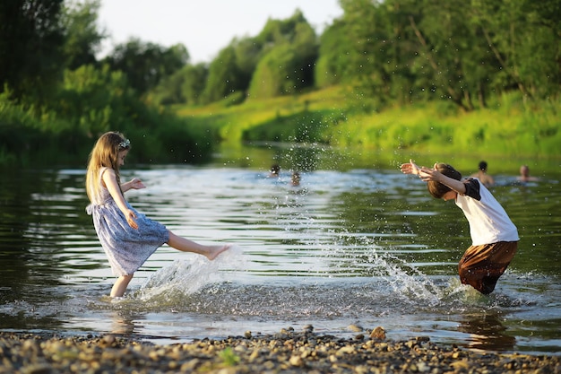 Children walk in the summer in nature Child on a sunny spring morning in the park Traveling with children