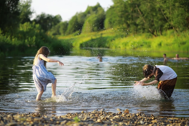 Children walk in the summer in nature Child on a sunny spring morning in the park Traveling with children