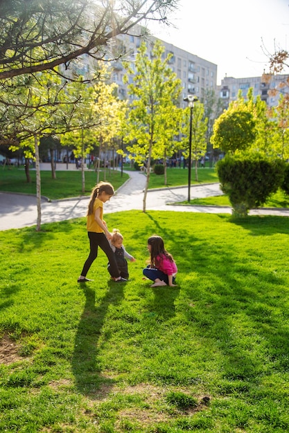 Children walk together in a friend's folder Selective focus