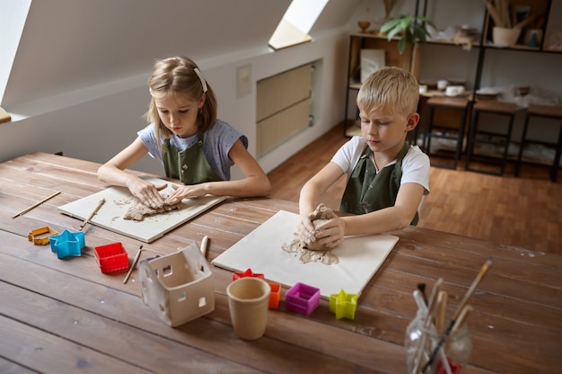 Children work with clay, kids in workshop