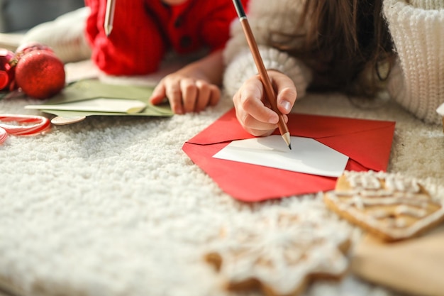 Children write a letter to Santa festive atmospheric photo