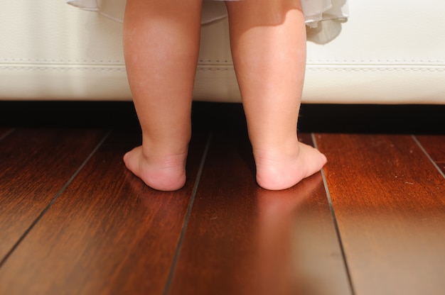 Childrens bare feet, beside to bed