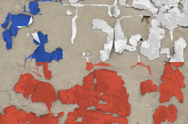 Chile flag depicted in paint colors on old obsolete messy concrete wall closeup. Textured banner on rough background