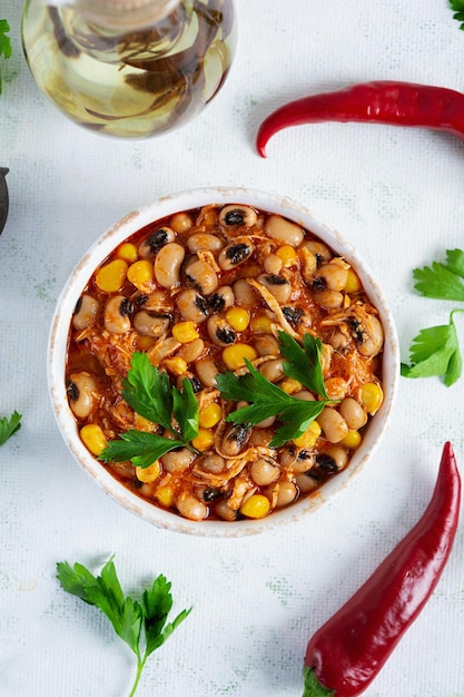 Chili con carne in a bowl Mexican cuisine Chili with meat corn and beans