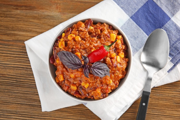 Chili con carne in bowl on table