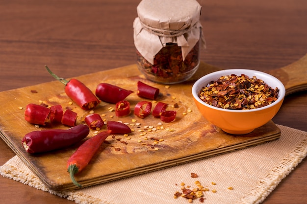 Chili pepper spices and fresh red chilli peppers.