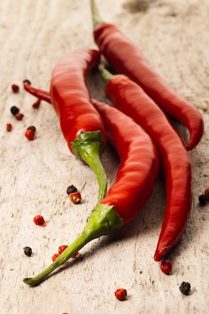 Chili peppers on old wood