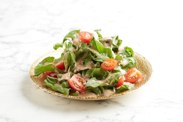 Chilled Iceplant with Tangy Sesame Dressing with chopsticks served in a dish isolated on grey background side view