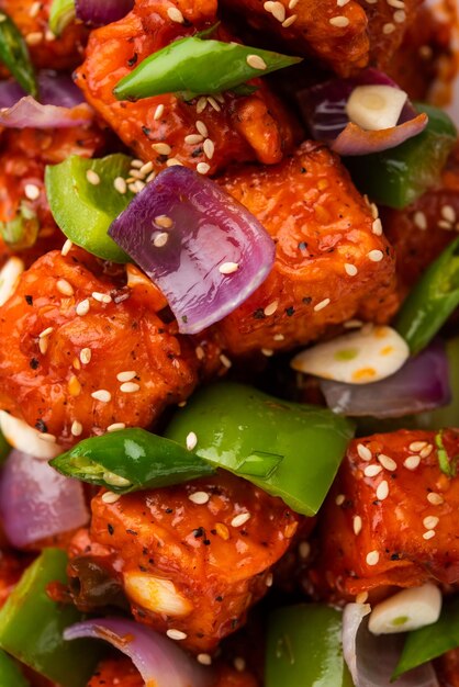 Photo chilli paneer dry is made using cottage cheese, indo chinese food