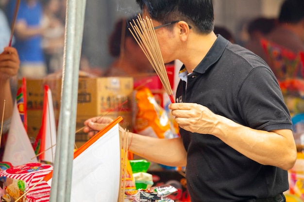 China traditional religion Chinese Ghost Festival believers burn incense and pray for blessing