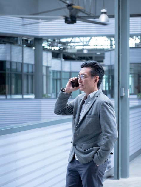 Chinese businessman talking on his cellphone