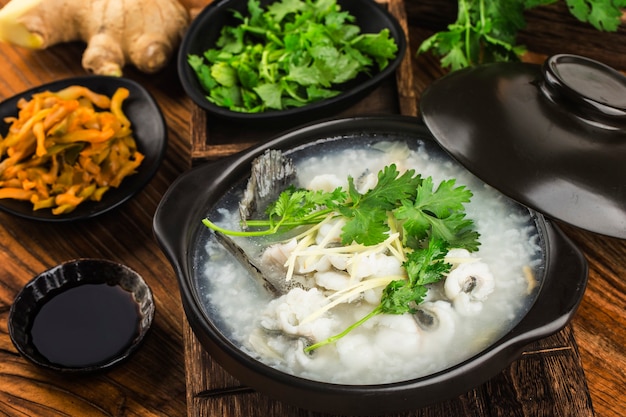 Chinese cuisine Congee with fish slices in casserole