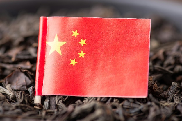 Chinese flag on tea leaves Concept of origin of tea plantations of tea in China harvest of tea