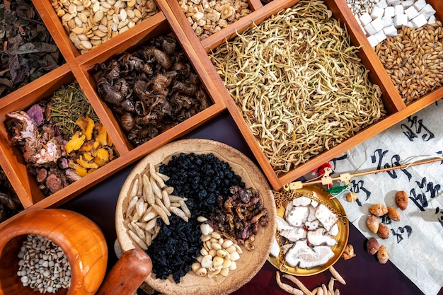 Chinese herbal medicine and flower tea on wooden