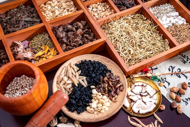 Chinese herbal medicine and flower tea on wooden