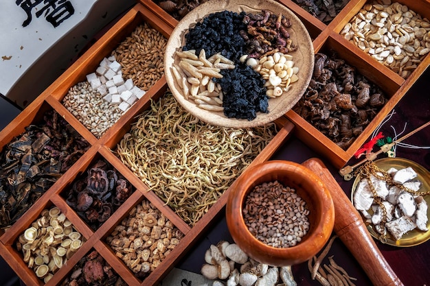 Chinese herbal medicine and flower tea on wooden