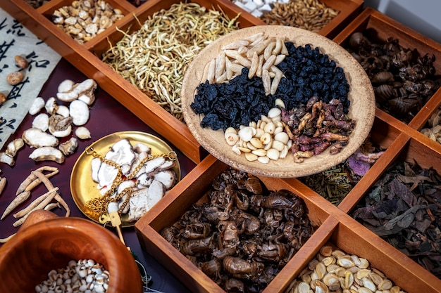 Chinese herbal medicine and flower tea on wooden