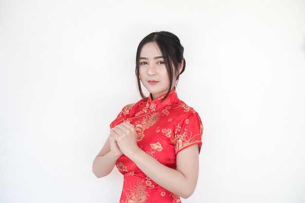 Chinese New Year.Asian women in traditional Chinese cheongsam dresses with greetings.