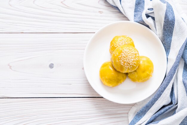 Chinese pastry or moon cake filled with mung bean paste and salted egg yolk 