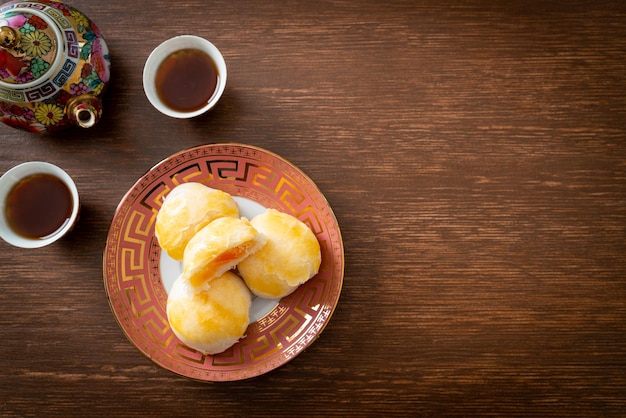 Chinese pastry moon cake with salted egg peanut or Spring Roll pastry with nuts and salted eggs - Asian food style