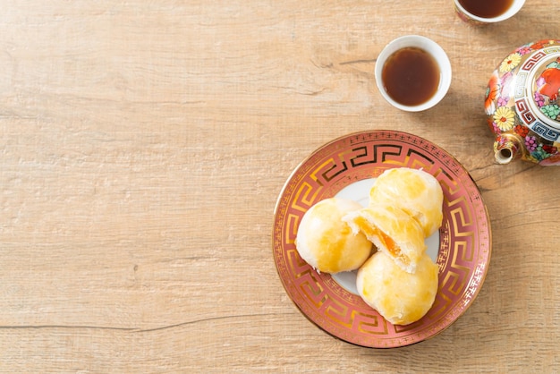 Chinese pastry moon cake with salted egg peanut or Spring Roll pastry with nuts and salted eggs - Asian food style