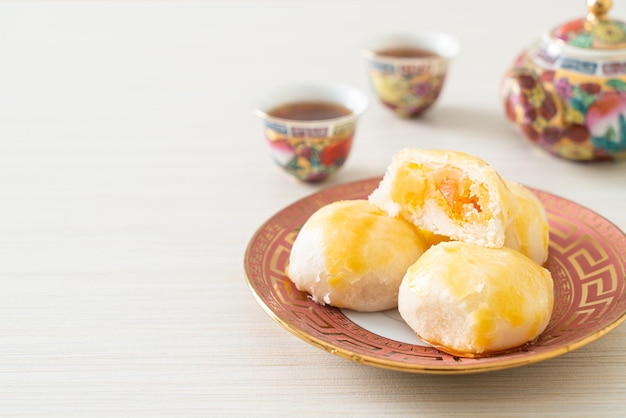 Chinese pastry moon cake with salted egg peanut or Spring Roll pastry with nuts and salted eggs