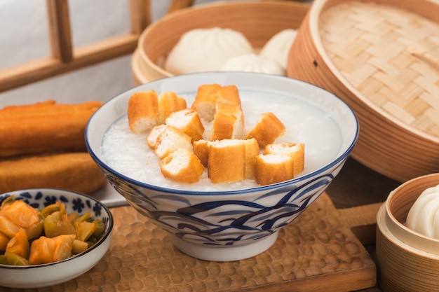 Chinese porridge breakfast set, fried dough sticks, white porridge,