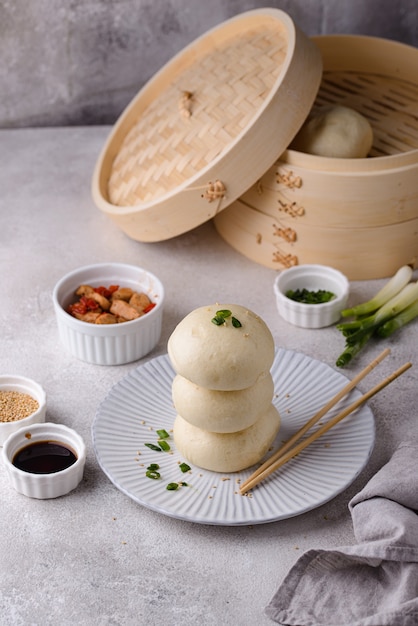 Chinese steamed buns baozi with steamer