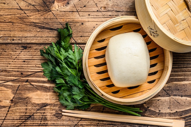 Chinese Steamed Buns in traditional bamboo steamer.