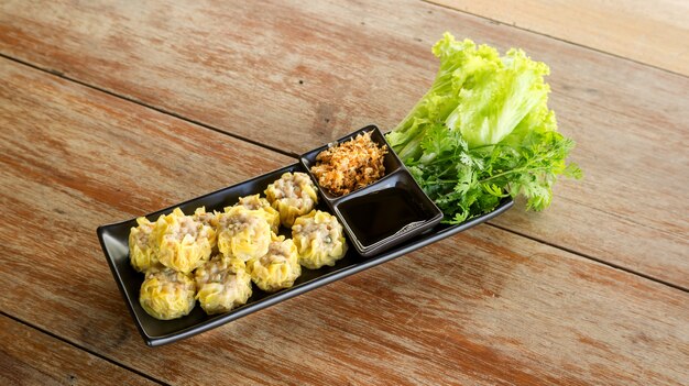 Chinese Steamed Dumpling on a black plate