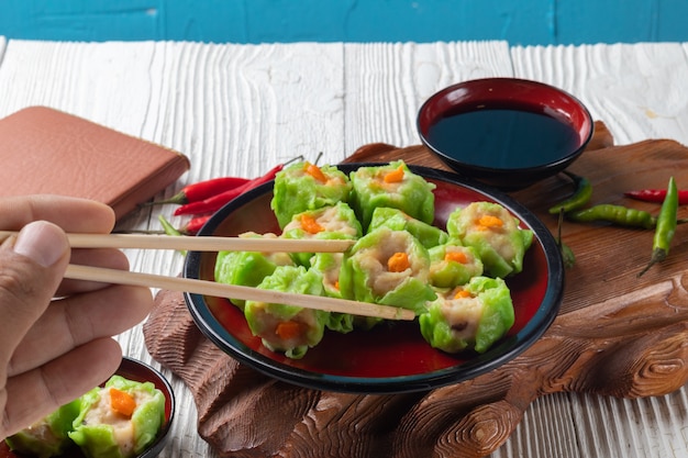 Chinese steamed pork dumpling dim sum on plate