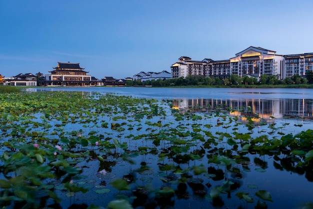 Chinese style buildings by the lake in the evening