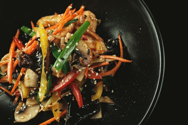 Chinese style chicken with mushrooms and vegetables