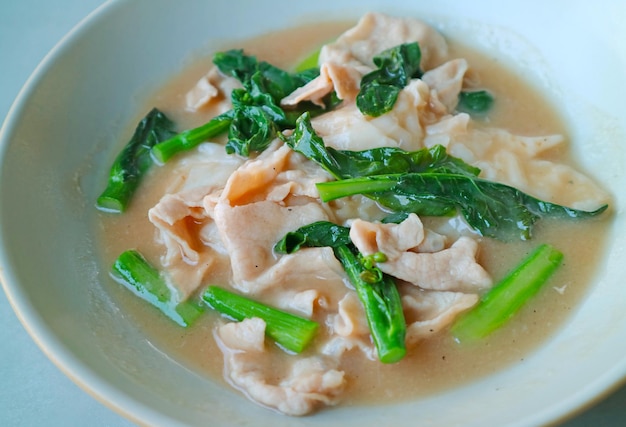 Chinese Style Rice Noodles with Pork and Kale in Gravy ' One of Popular Dishes in Thailand