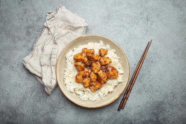 Chinese sweet and sour sticky chicken with sesame seeds and