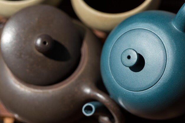 Chinese tea ceremony Ceramic teapot made of clay and bowls on a wooden background