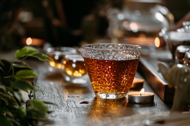 Chinese tea ceremony with candle flame decoration on a dark background