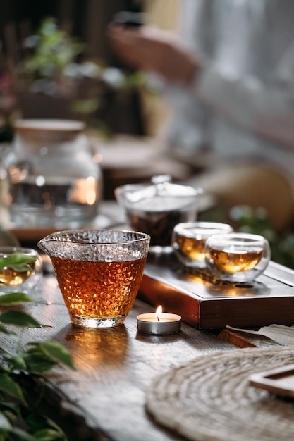 Chinese tea ceremony with candle flame decoration on a dark background